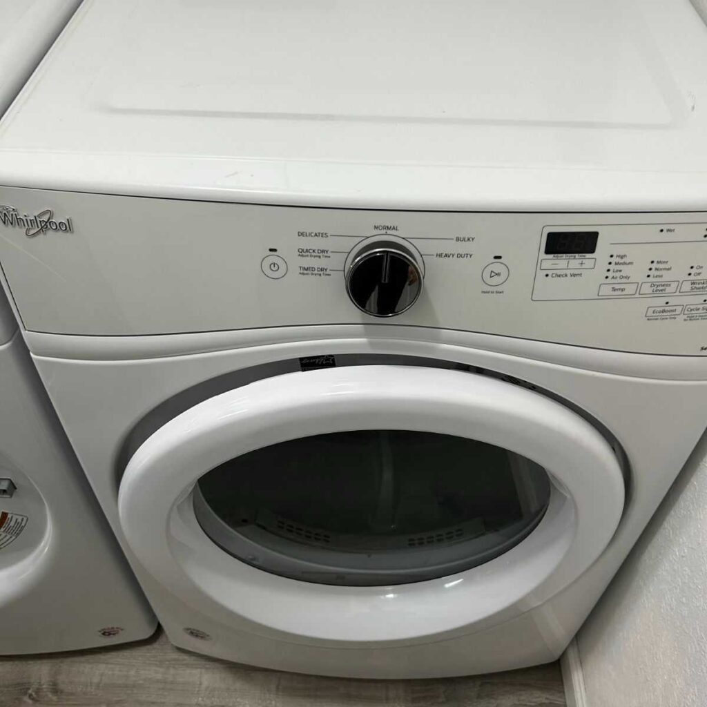 Whirlpool dryer control panel and door, showcasing settings for drying cycles and efficiency, relevant to Whirlpool dryer repair services in Cleveland.