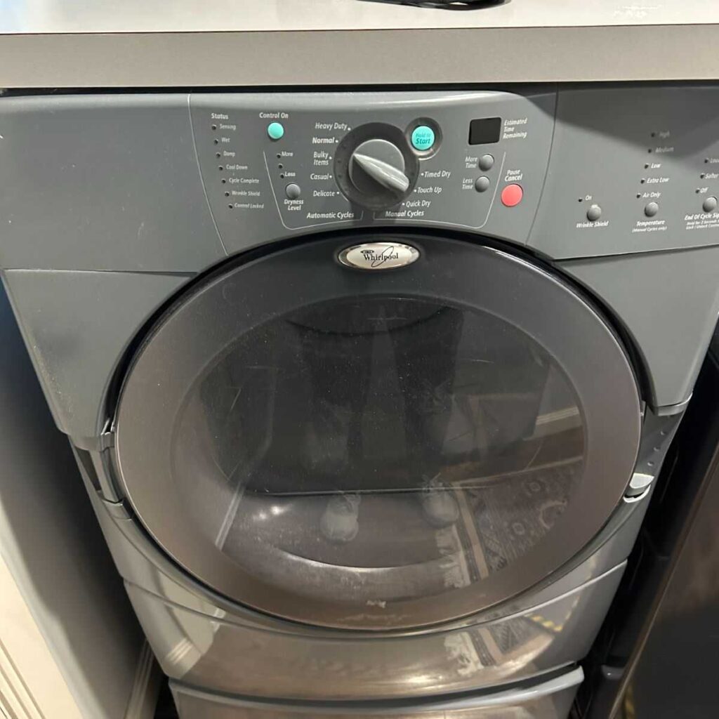 Whirlpool dryer control panel with various cycle options and start button, illustrating appliance repair context for Brecksville homeowner's dryer issues.